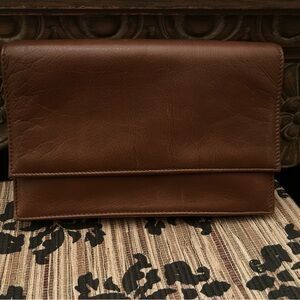 Brown Leather Wallet with Sleek Design and Flap Closure